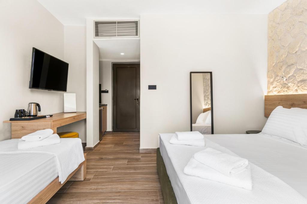 Posteľ alebo postele v izbe v ubytovaní Sigma Luxury Rooms