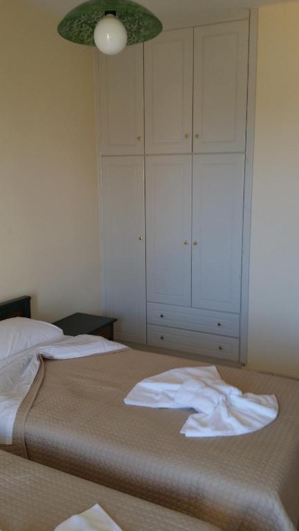 Postel nebo postele na pokoji v ubytování Mythos Beach Hotel Apartments