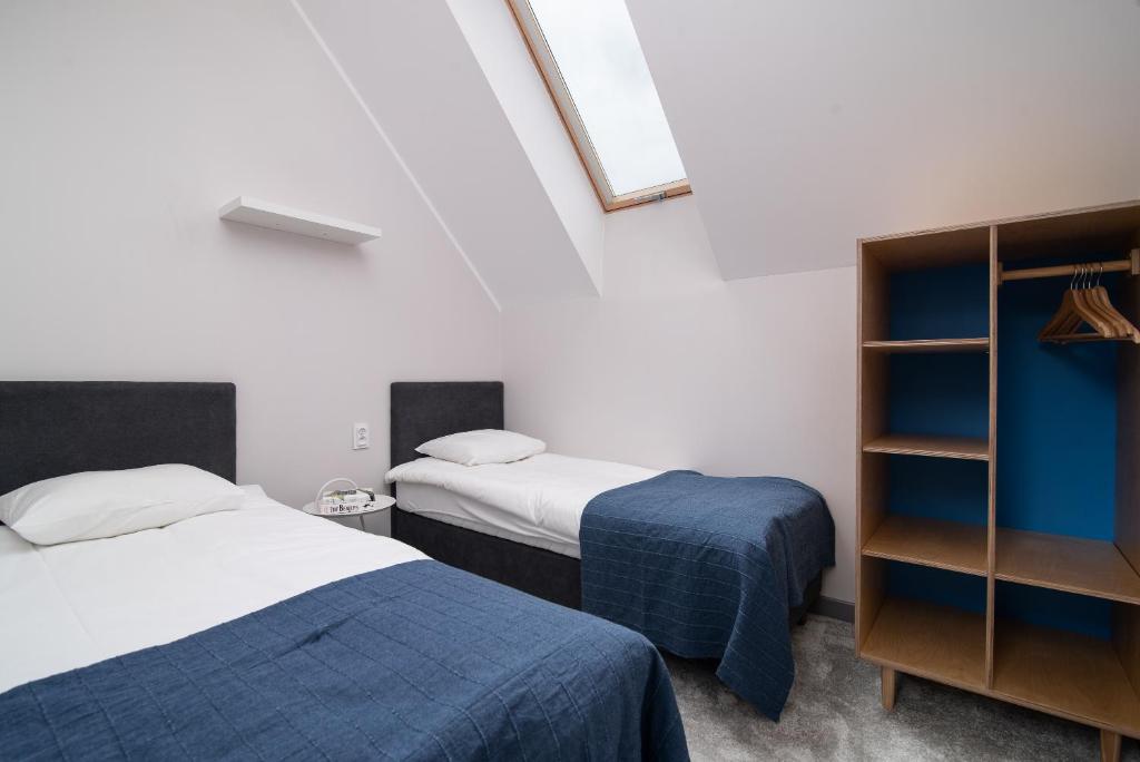 Postel nebo postele na pokoji v ubytování Domy Apartamentowe - Na Makowej