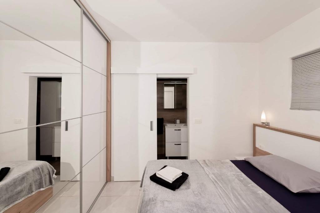 Postel nebo postele na pokoji v ubytování Apartment White Pearl