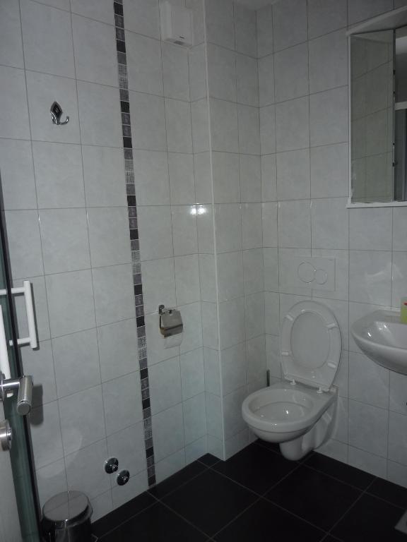 Koupelna v ubytování Rooms & Apartment Mira G.