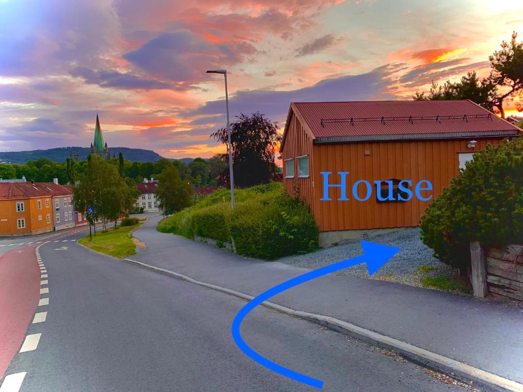 an image of a house on the side of a road at Private house-terrace-garden -parking-WiFi-smartTV in Trondheim