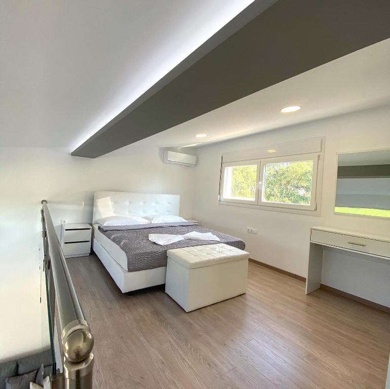 A bed or beds in a room at IL-Holidays Paralia