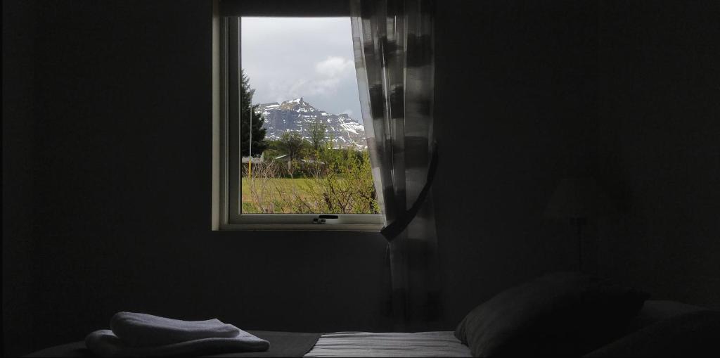 a window with a view of a city at SAXA Guesthouse in Stöðvarfjörður
