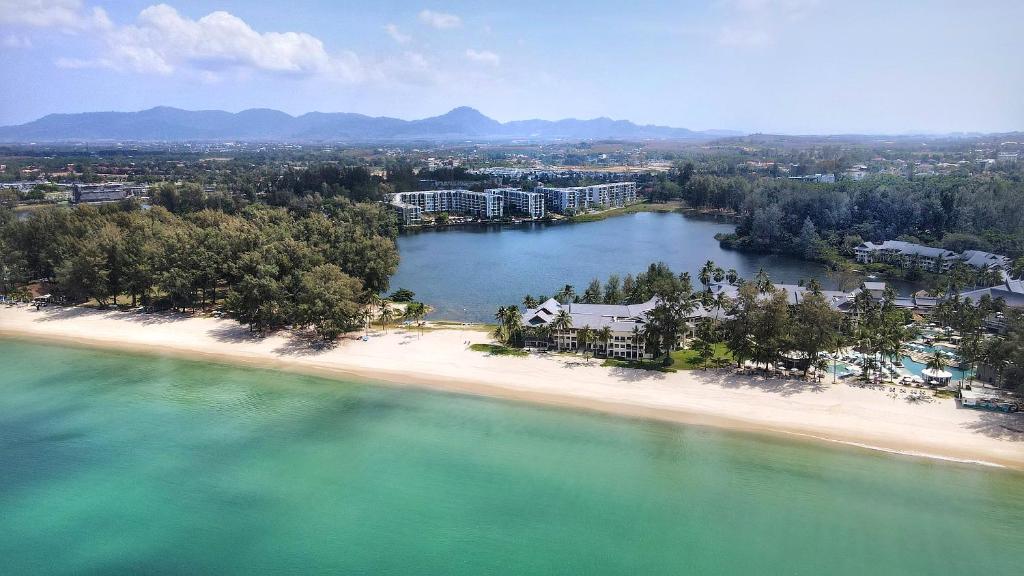 an aerial view of a beach with a resort at Cassia Residences by Laguna Phuket in Bang Tao Beach