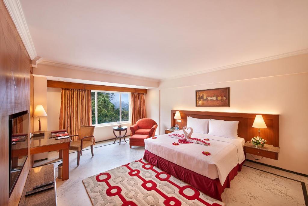 Postel nebo postele na pokoji v ubytování Accord Highland Hotel Ooty