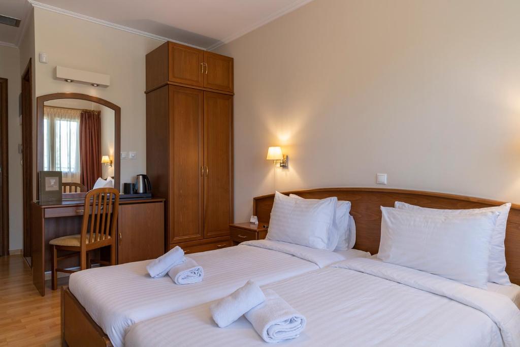 Postel nebo postele na pokoji v ubytování Xenios Dias Boutique Hotel