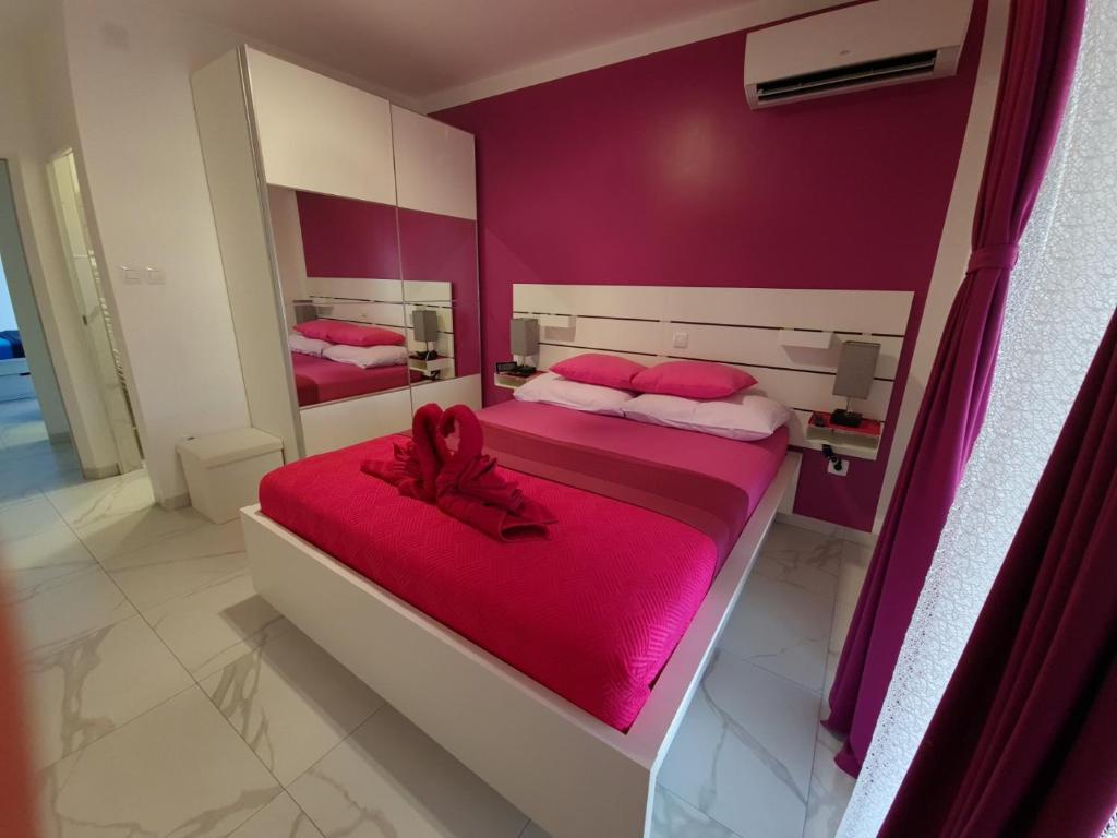 Posteľ alebo postele v izbe v ubytovaní TJ Apartment
