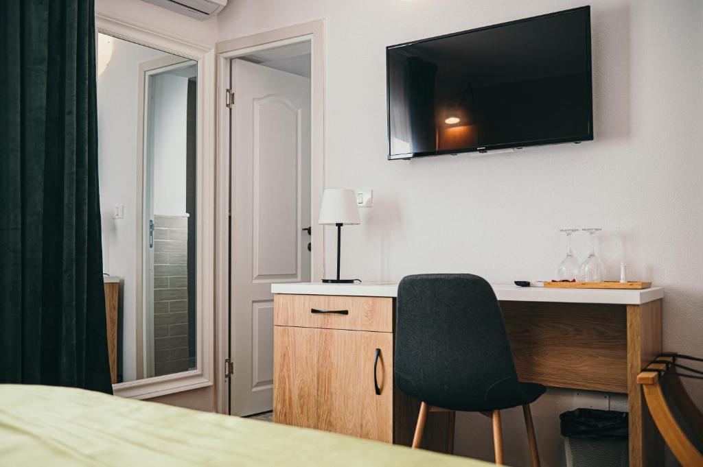 TV a/nebo společenská místnost v ubytování Nest Guesthouse