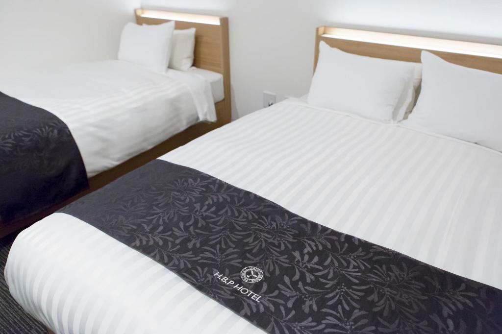 Postel nebo postele na pokoji v ubytování H.B.P HOTEL
