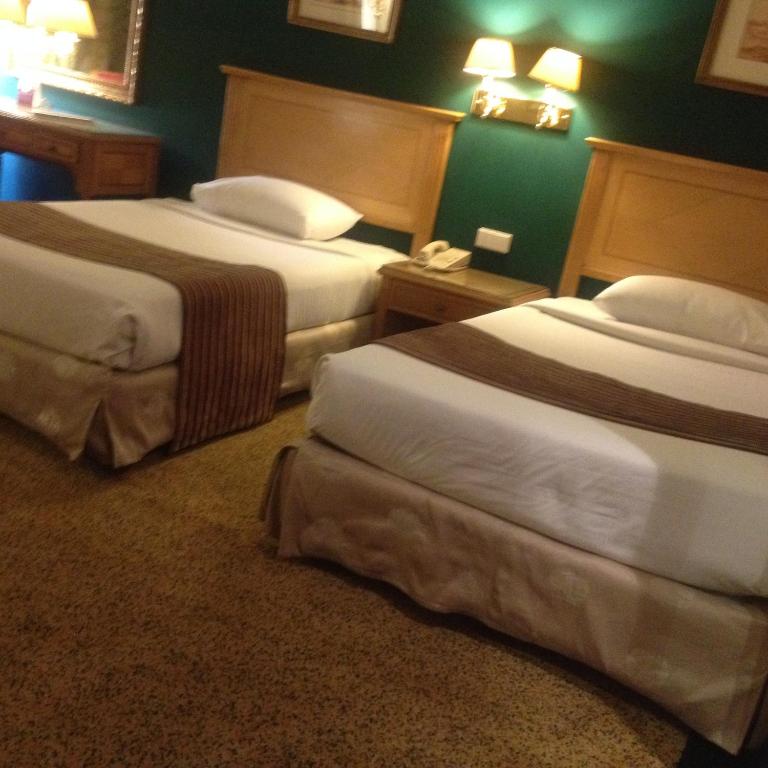 Postel nebo postele na pokoji v ubytování Amarante Pyramids Hotel