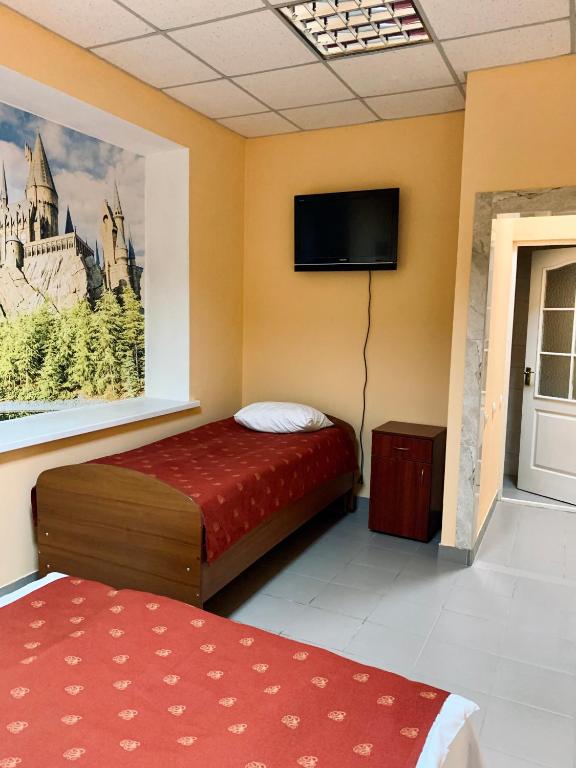 Postel nebo postele na pokoji v ubytování У Поттера