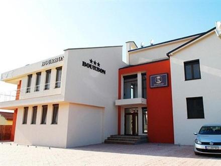 a building with a car parked in front of it at HOTEL BOURBON Vama Veche in Vama Veche