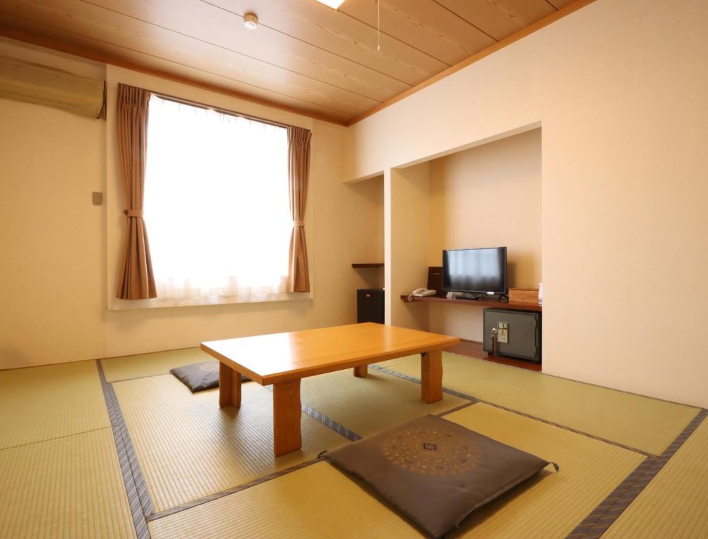 TV a/nebo společenská místnost v ubytování Hotel Cerulean Alpine