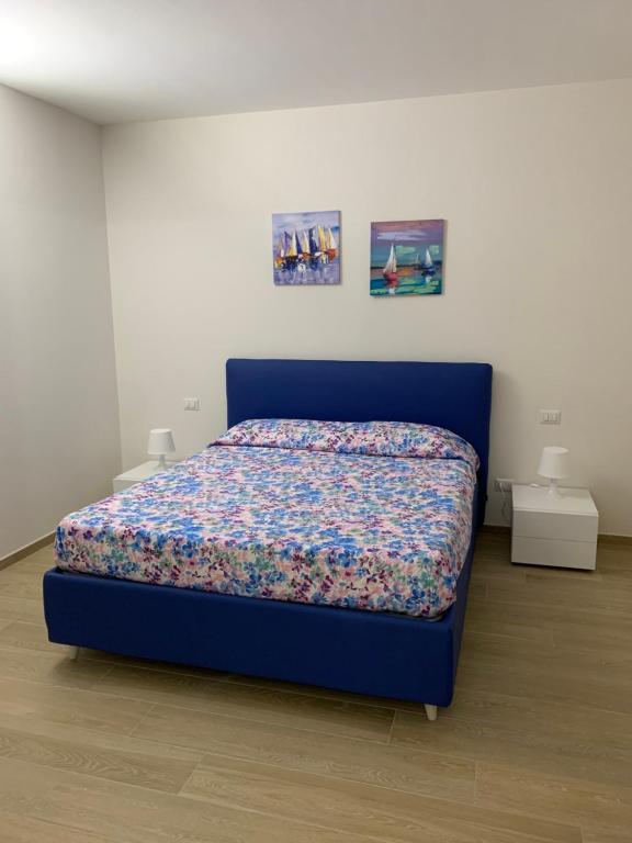 Ein Bett oder Betten in einem Zimmer der Unterkunft Olimpia residence