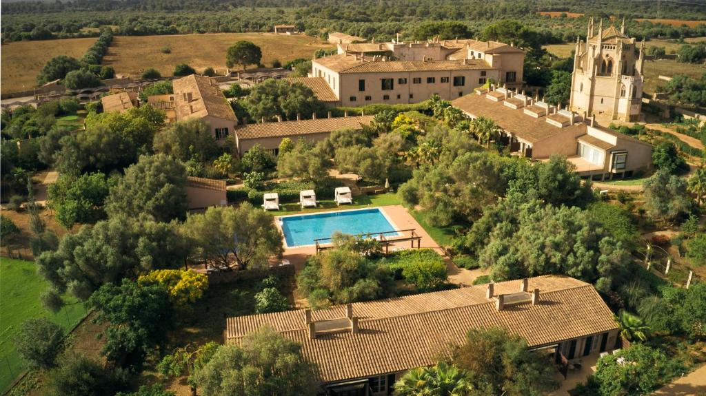 an aerial view of a house with a swimming pool at Zoetry Mallorca Wellness & Spa in Llucmajor