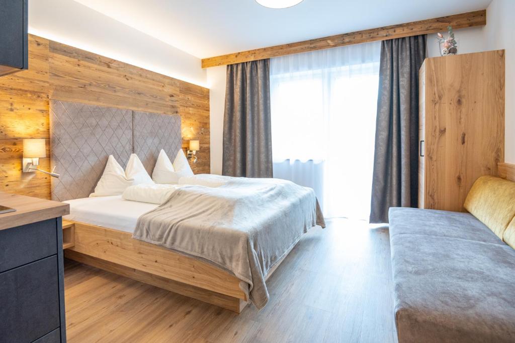 Postel nebo postele na pokoji v ubytování Apartment Bergsee