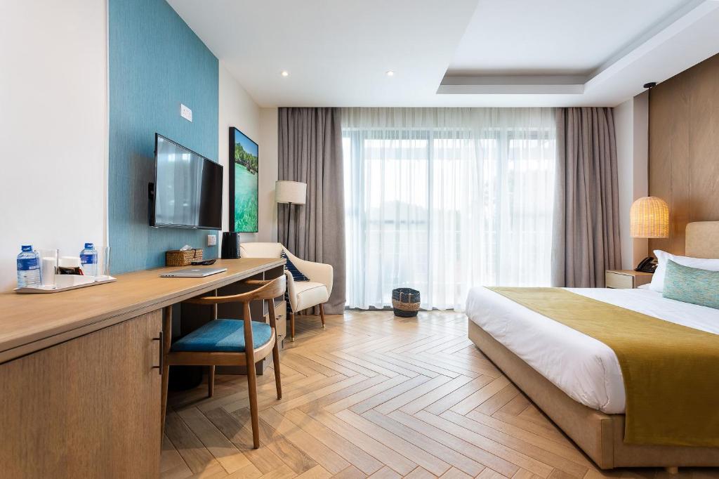 TV a/nebo společenská místnost v ubytování Ulwazi Place Hotel by Trianum