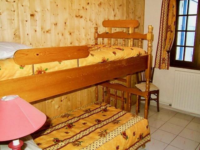 Postel nebo postele na pokoji v ubytování le vieux pont