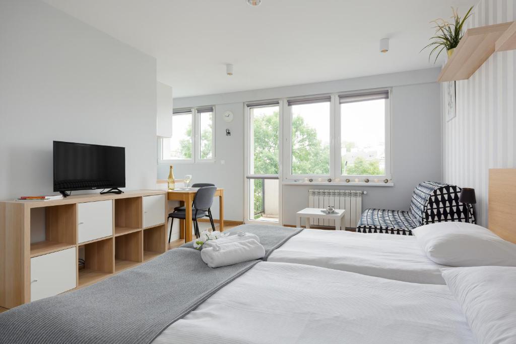 Posteľ alebo postele v izbe v ubytovaní Apartments City Center Powiśle by Noclegi Renters