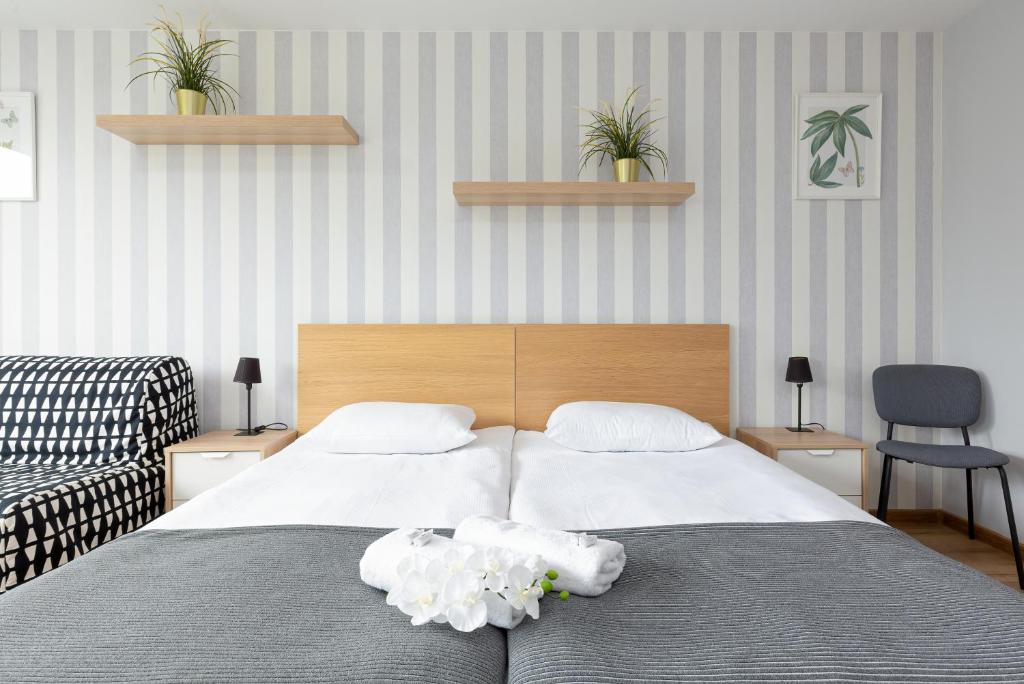 Posteľ alebo postele v izbe v ubytovaní Apartments City Center Powiśle by Noclegi Renters