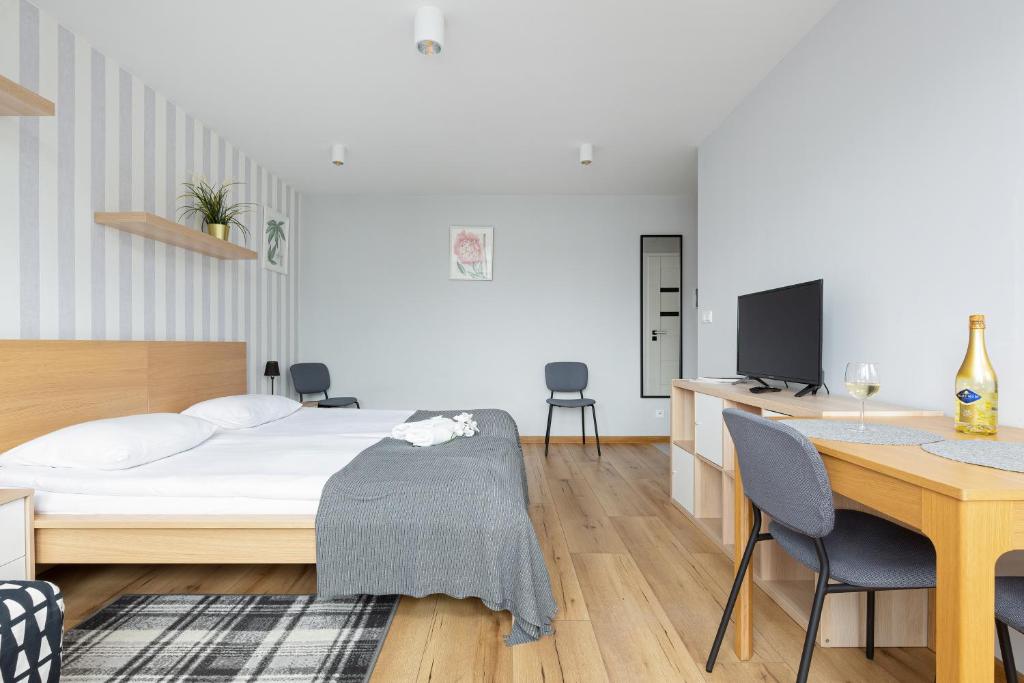 Posteľ alebo postele v izbe v ubytovaní Apartments City Center Powiśle by Noclegi Renters