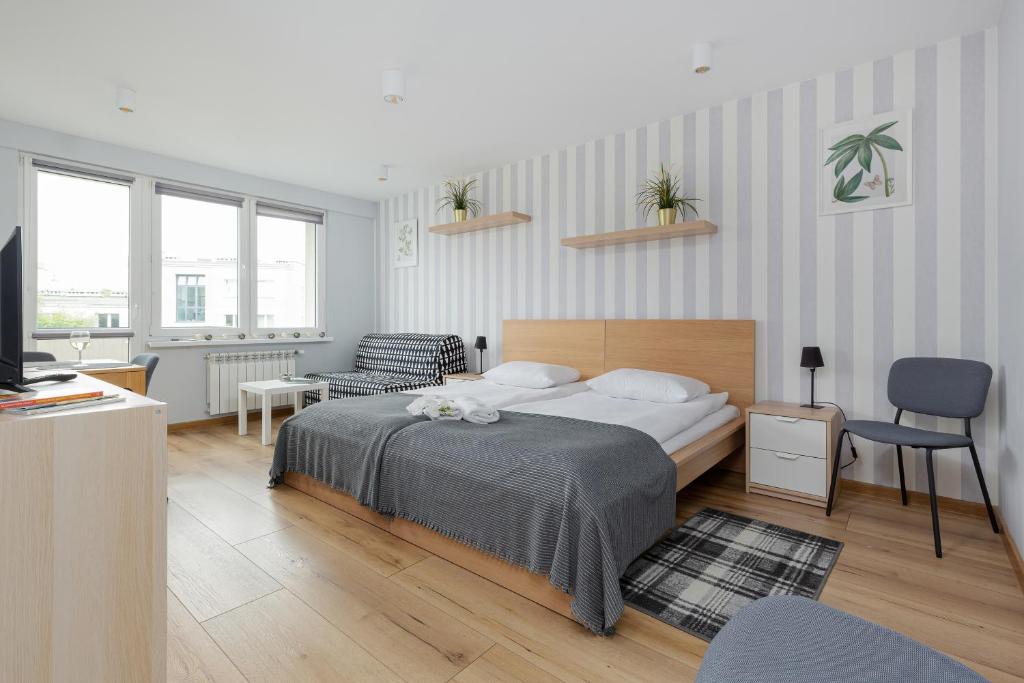 Posteľ alebo postele v izbe v ubytovaní Apartments City Center Powiśle by Noclegi Renters