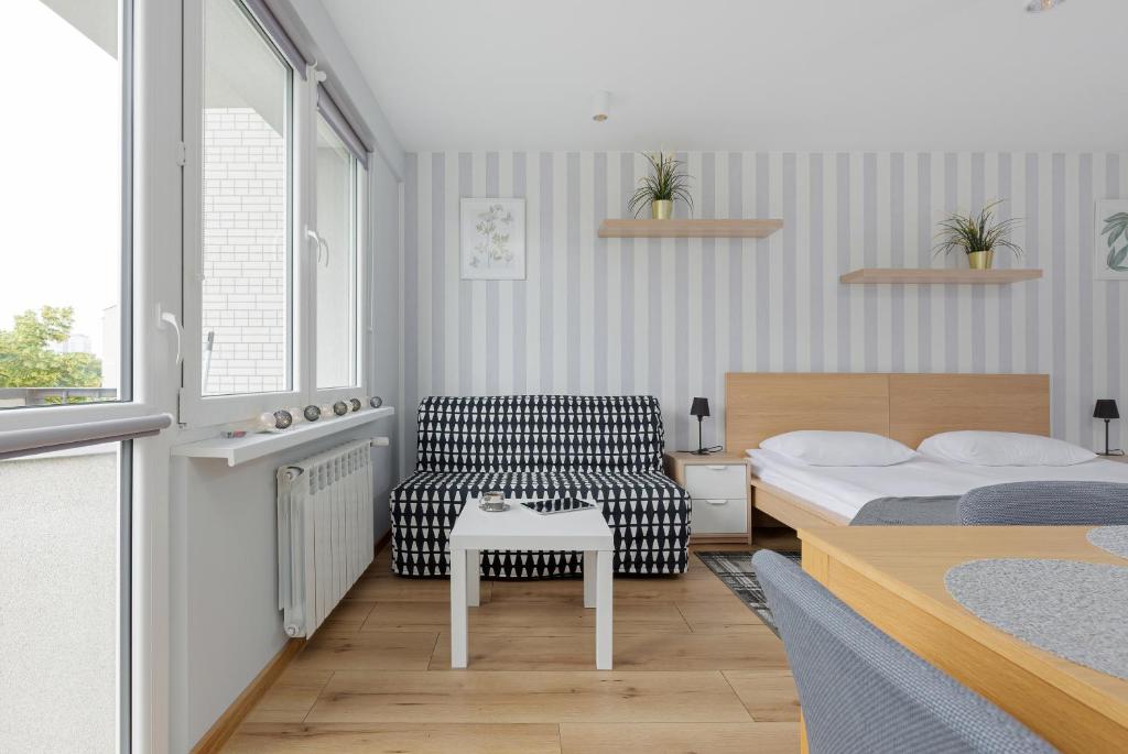 Posteľ alebo postele v izbe v ubytovaní Apartments City Center Powiśle by Noclegi Renters