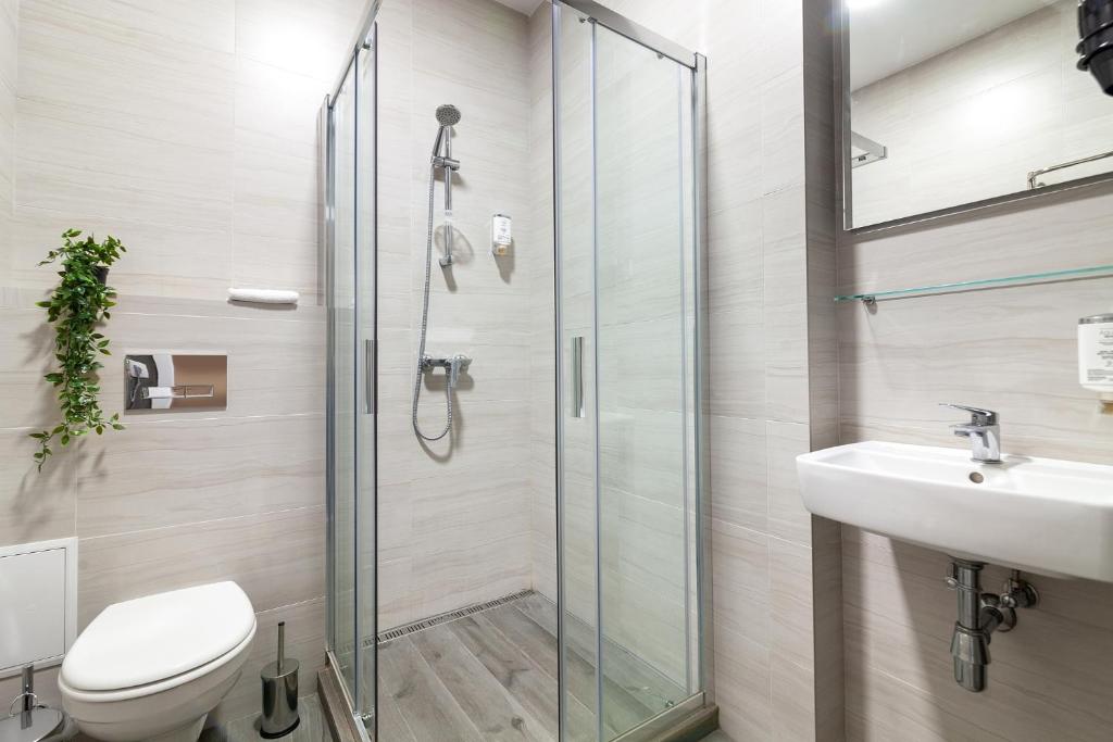 Koupelna v ubytování AUSTRIAN APART HOTEL