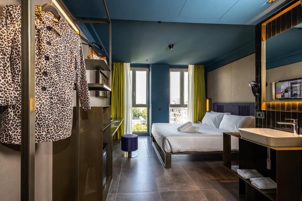 Postel nebo postele na pokoji v ubytování HD8 Hotel Milano