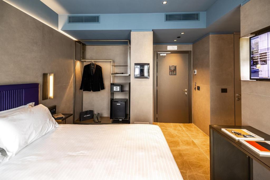 Postel nebo postele na pokoji v ubytování HD8 Hotel Milano