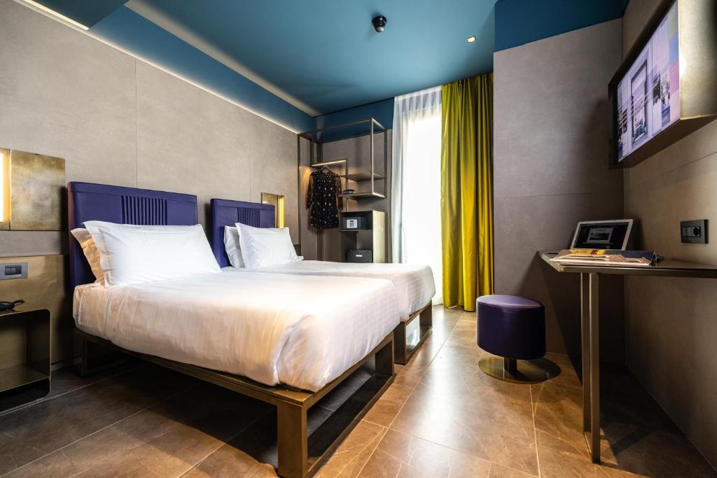 Postel nebo postele na pokoji v ubytování HD8 Hotel Milano