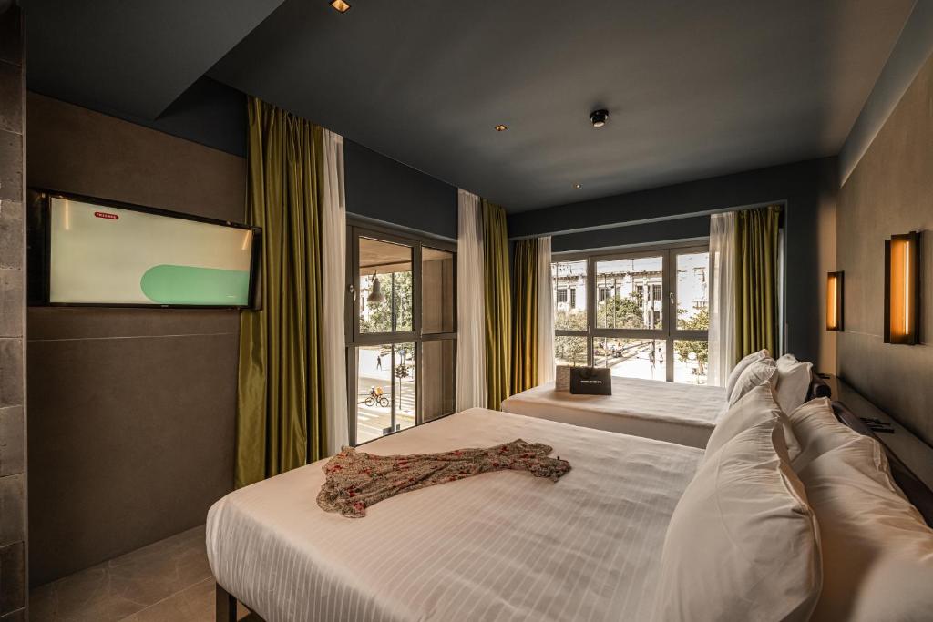 Postel nebo postele na pokoji v ubytování HD8 Hotel Milano