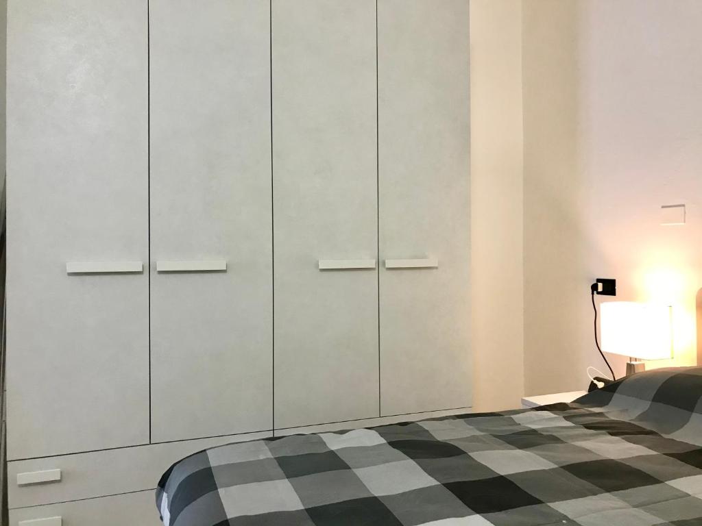 Posteľ alebo postele v izbe v ubytovaní Il Ciottolo Apartments