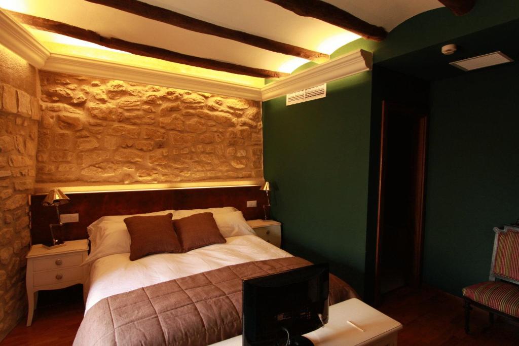 Postel nebo postele na pokoji v ubytování Hotel del Sitjar