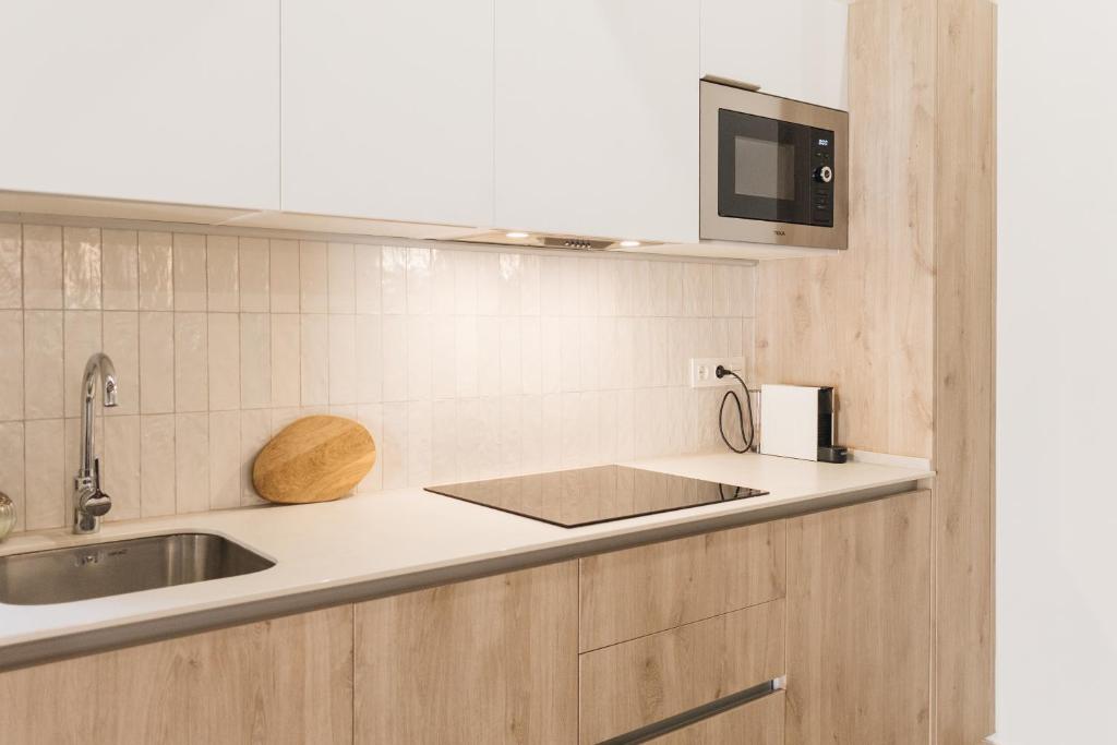 Kuchyňa alebo kuchynka v ubytovaní Apartaments la rambla - Garnatxa - 4 persones