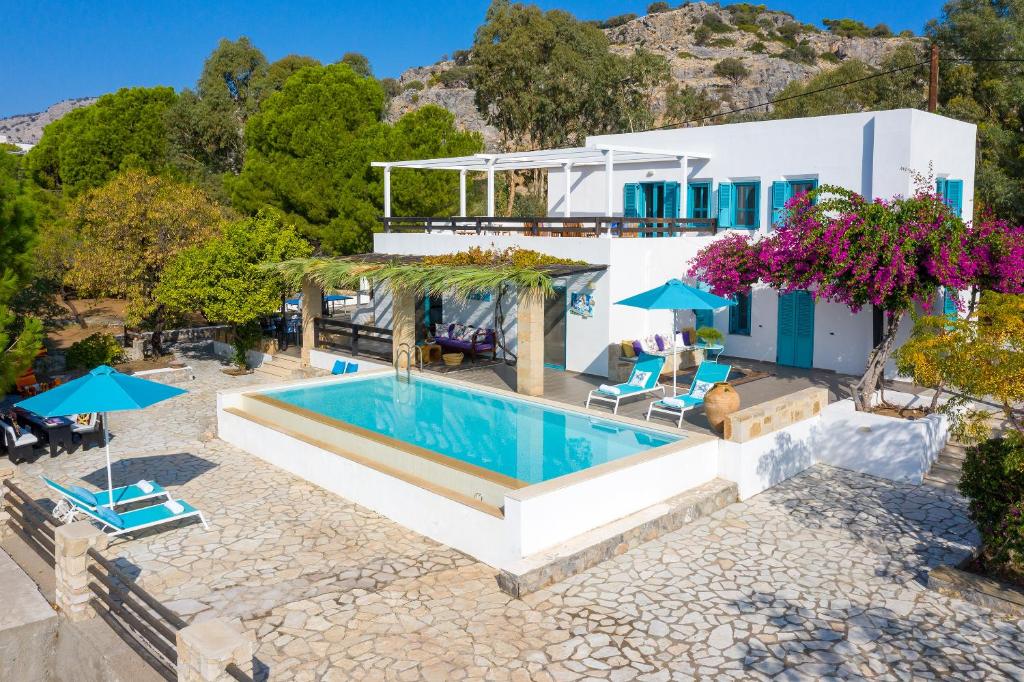 an aerial view of a house with a swimming pool at Villa Mary's Holiday House in Pefki