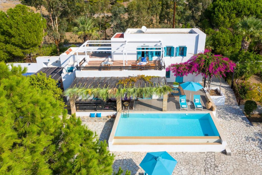 an aerial view of a house with a swimming pool at Villa Mary's Holiday House in Pefki