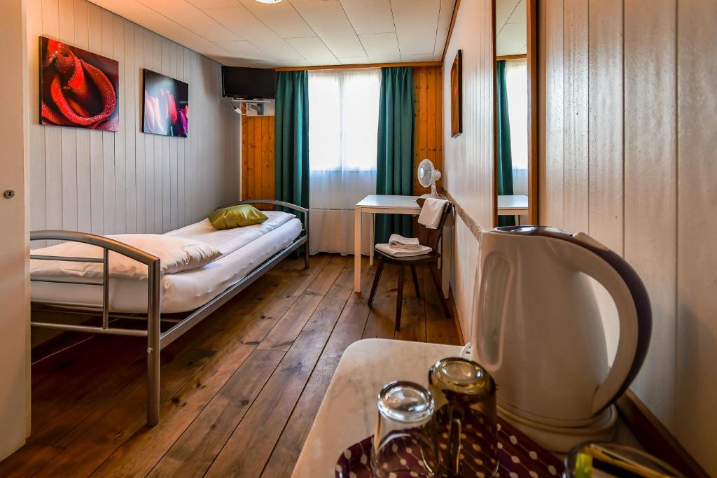 Letto o letti in una camera di Hotel Tell and Apartments