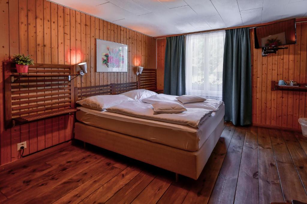 Letto o letti in una camera di Hotel Tell and Apartments