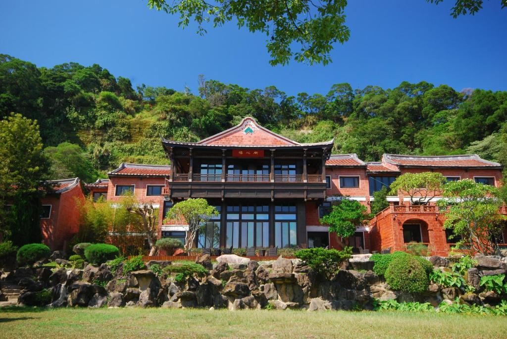 a large brick building with a roof at The One Nanyuan in Xinpu