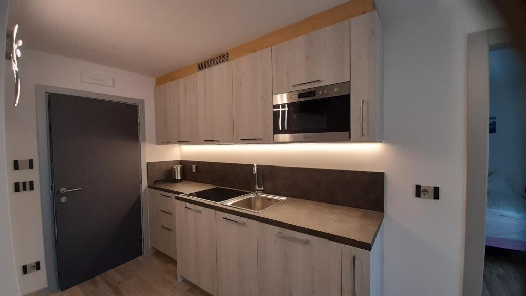 Kuchyň nebo kuchyňský kout v ubytování casa vacanze arcobaleno