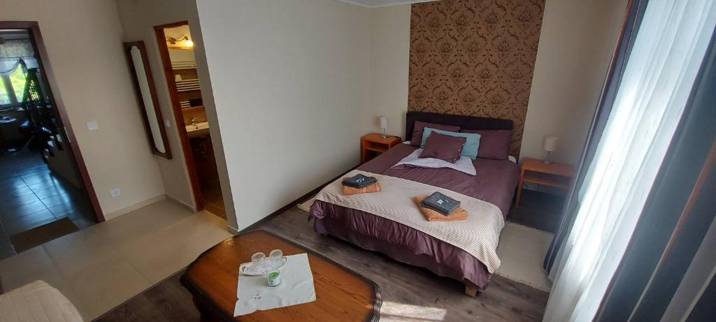 Postel nebo postele na pokoji v ubytování Villa VértesKacsa