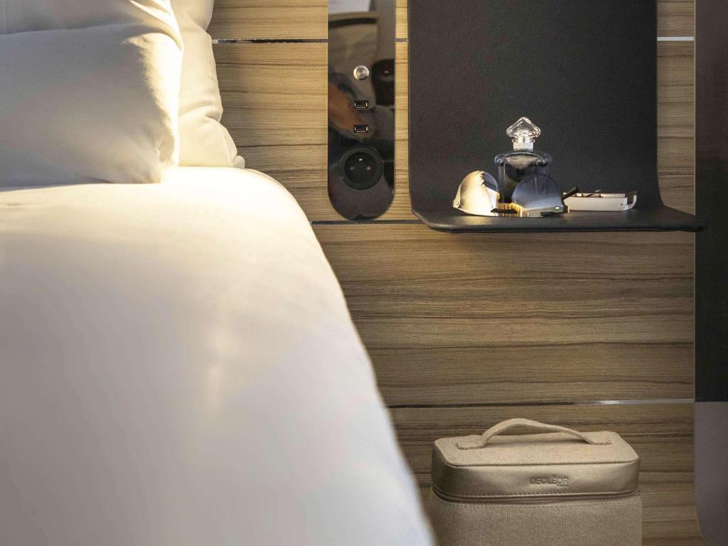 Postel nebo postele na pokoji v ubytování Novotel Annecy Centre