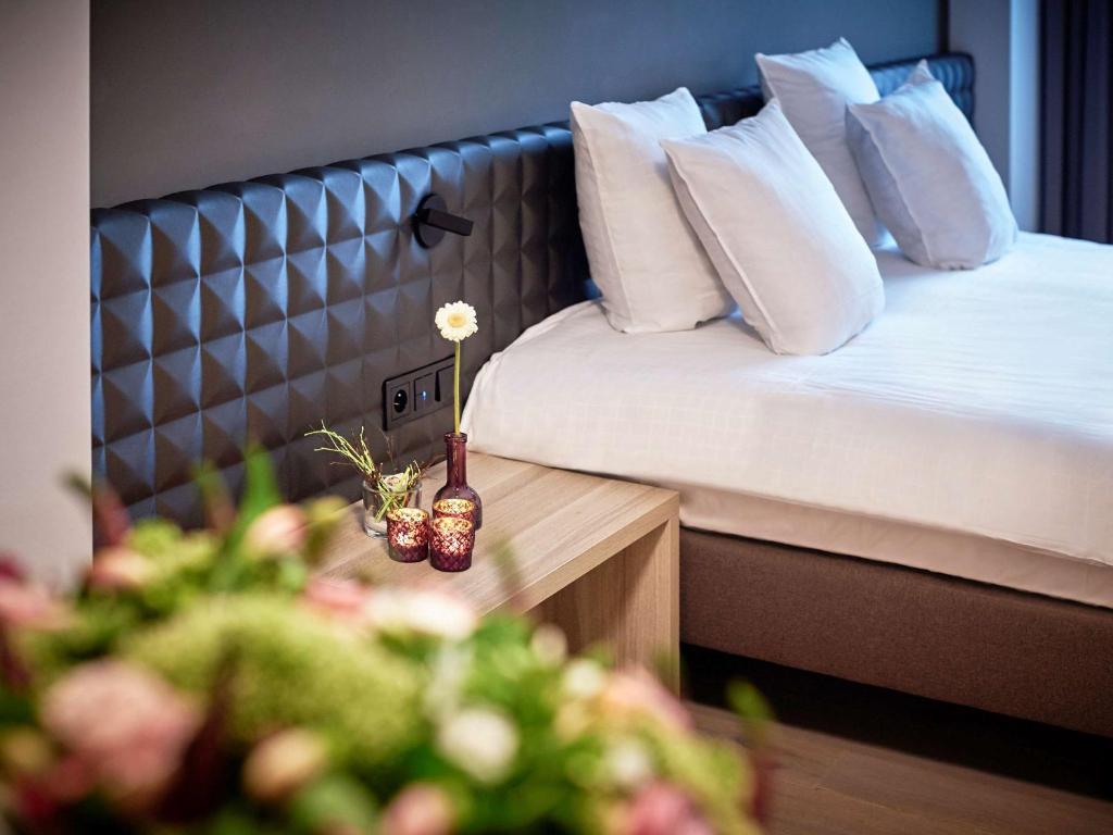 Postel nebo postele na pokoji v ubytování Mercure Roeselare