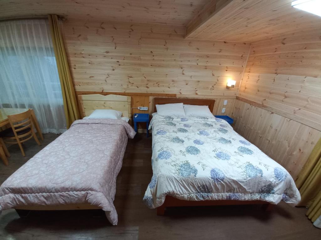 Postel nebo postele na pokoji v ubytování Good Day Pension