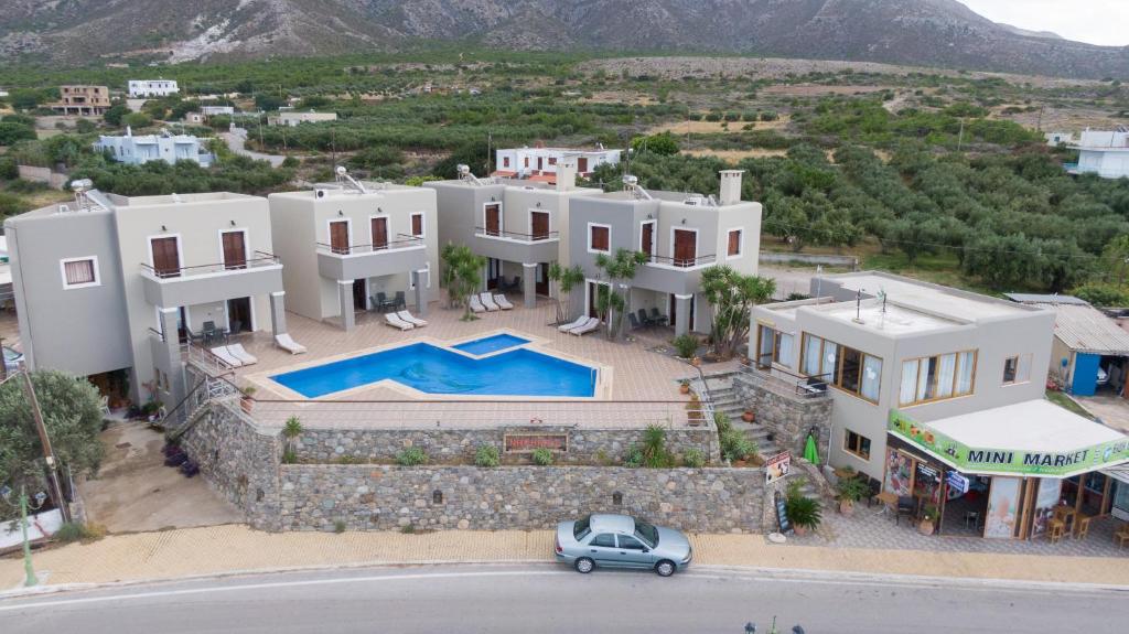 - une vue aérienne sur une villa avec une voiture garée devant dans l'établissement Nireides villas 'TOP DESTINATION', à Elafonisi