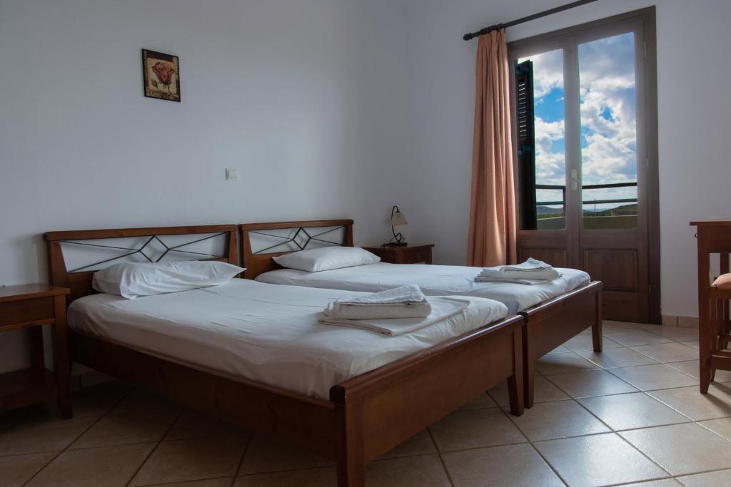 Postel nebo postele na pokoji v ubytování Nireides villas 'TOP DESTINATION'