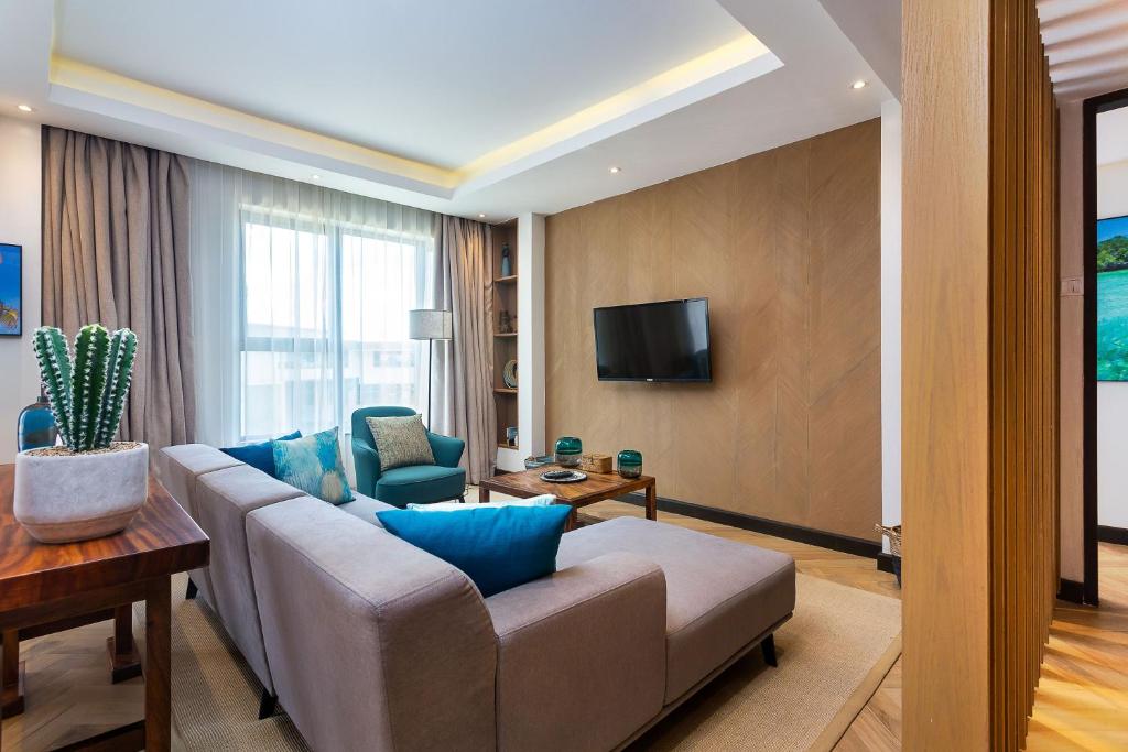 TV a/nebo společenská místnost v ubytování Ulwazi Place Hotel by Trianum