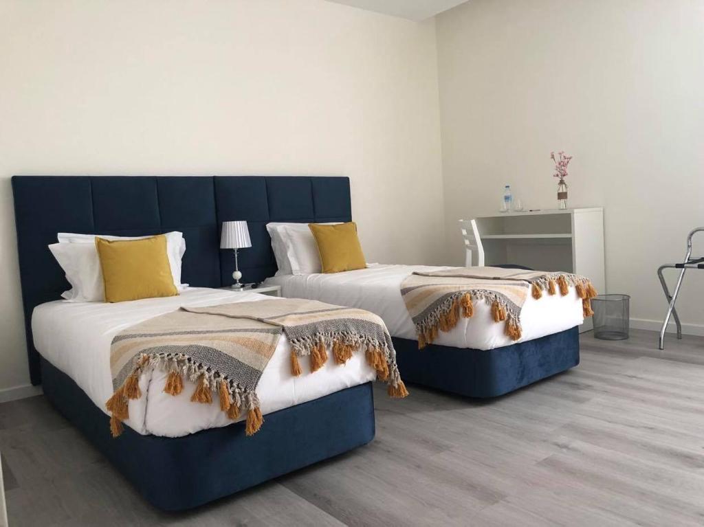 Postel nebo postele na pokoji v ubytování CFS Azores Guest House